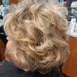 Heavy highlights with a fun messy curl  80 ?? Maybe !!!