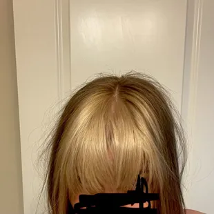 My hair after leaving the salon with "face framing" and "baby lights" blonde chunk dark back.