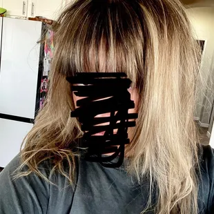 The dark black in the front blonde in the back no refund. This is the stylist that trains everyone there.