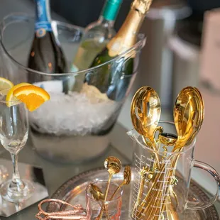 Private party friendly gold cutlery and champagne ice bins.