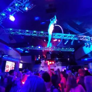 People danced underneath her.