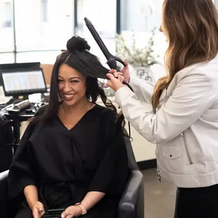 Getting ready for the reveal of her new hair with the perfect beach waves