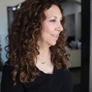 Natural looking custom colored curly hair extensions