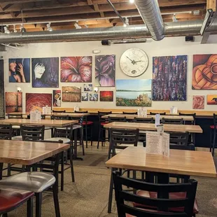 Artwork by one of the owners. Ample seating in refurbished industrial building.