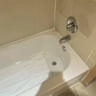 The tub had rust around the drain.