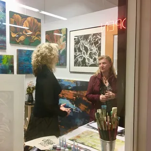 June Lee Palmer in her studio with Hawaiian Art