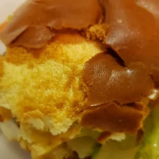 The crust falls off the bun as you eat the cheeseburger.
