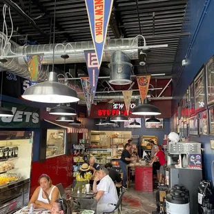 people sitting at tables in a restaurant