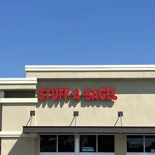 two cars parked in front of a store