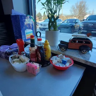 Booth has a good view with many condiments and novelty truck and lucky bamboo plant.  Saturday 2/4/2023