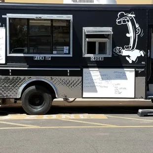 a hot dog in a parking lot