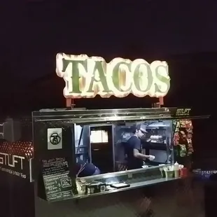 a tacos stand at night