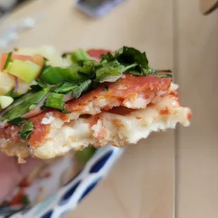 a slice of pizza on a plate