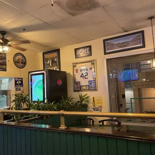 a bar with a large screen tv