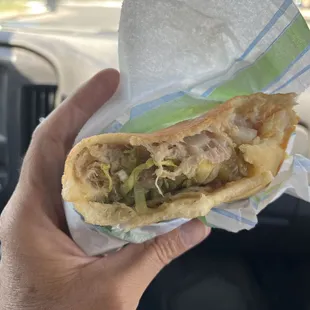 Stufy's.  Stuffed sopapilla, #11.  Shredded chicken, lettuce, and green chile.