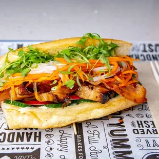 New Location: 1928 Fleet St
introducing the 
       Banh Mi - 
pork belly, bacon, pickled veggies served with Pho Dip - woah!