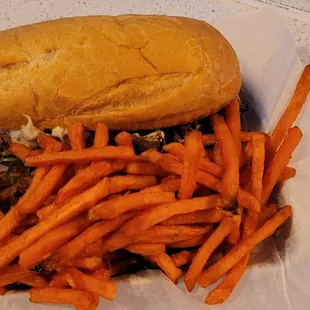 Cheesesteak with sweet potato fries.