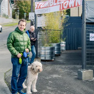 a man and his dog on a leash