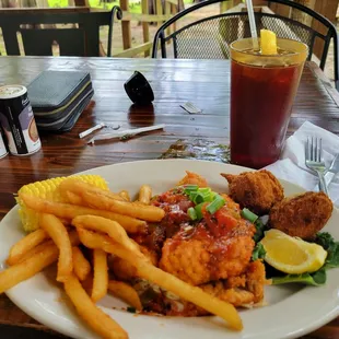 Louisiana gator plate with hushpuppys season fries