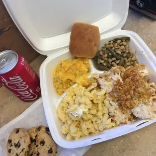 a tray of food and a can of coke