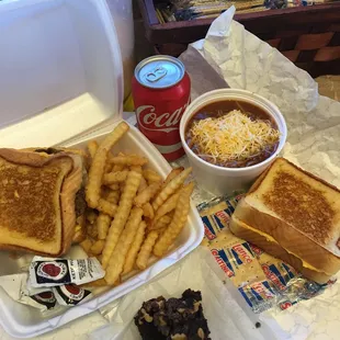 a tray of food and a can of coke
