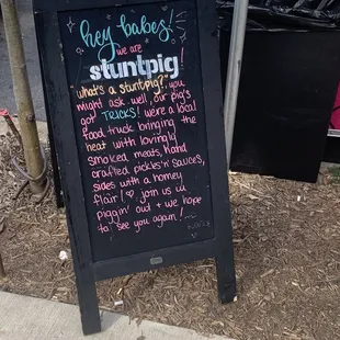 a sign on the side of a sidewalk