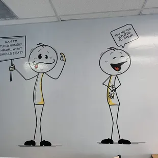 a man and a woman holding signs