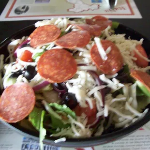 Italian Lettuce Salad with all the pizza toppings and your choice of dressing, $7.95.