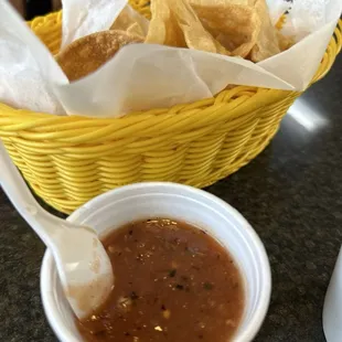 Crispy tortilla chips with very hot salsa
