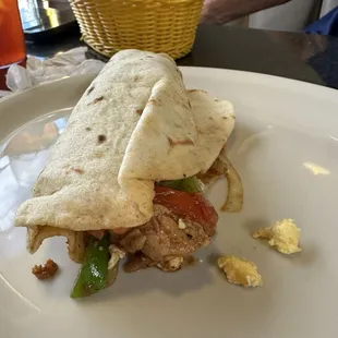 Chicken fajita burrito with eggs for breakfast