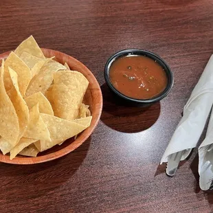 a bowl of tortilla and a bowl of salsa