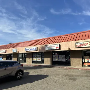 a car parked in front of a store