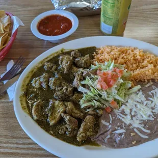 Ribeye Beef tips in chili verde sauce. with a side of rice and beens. Your choice of flour or corn tortilla.