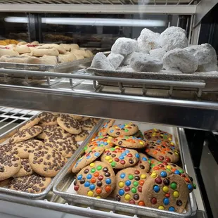 a variety of cookies in a display case