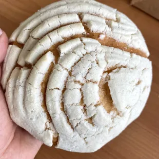 a hand holding a freshly baked cookie