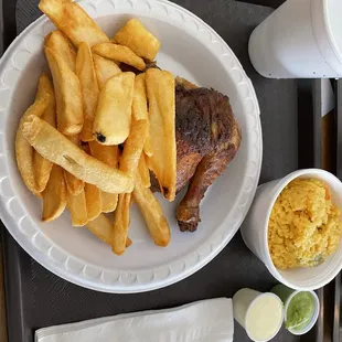 Quarter chicken with fries and rice