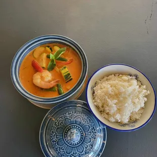 a bowl of rice, a bowl of shrimp, and a bowl of shrimp