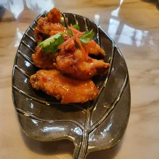 a plate of chicken wings