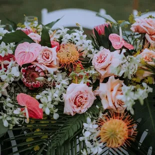 Close up ceremony flowers being used for the sweetheart table.