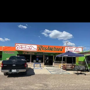 a truck parked in front of the restaurant