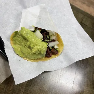 Carne asada taco! It already comes with guacamole!! Yummmmyyy!!