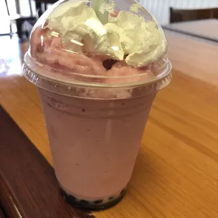 Boba tea yummy! I love strawberry boba tea and the whip cream on top is even better and the boba balls yum!
