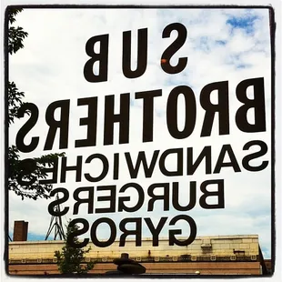 a sign in front of a building