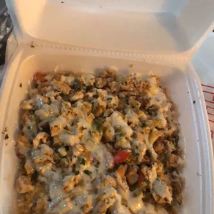 a takeout container of a macaroni and cheese casserole