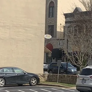 View from the side, small sign on corner of building