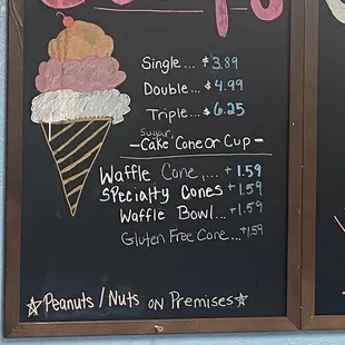 a menu for scoops on a chalkboard
