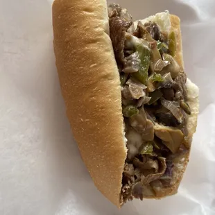 a sandwich with meat and vegetables