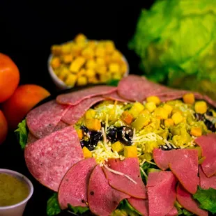 Antipasto Salad (Dry salami, Cotto Salami, Croutons, Parmesan Cheese, Olives, Pepperchinis, and Your Choice of Toppings)