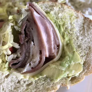 a sandwich with meat and lettuce