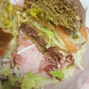 Ruben all the way on salt wheat with banana peppers, jalapeños, and horseradish added